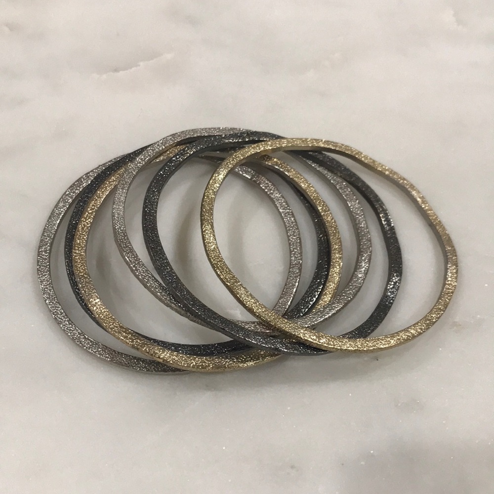 Six bangles- (2 gold, 2 silver, 2 dark gray)